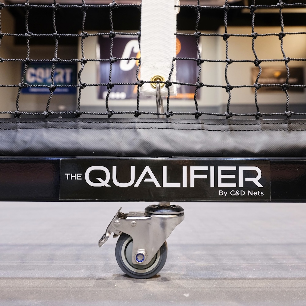 C&D QUALIFIER Portable Pickleball Net System 26 Portable pickleball net with non-marking wheels on indoor court